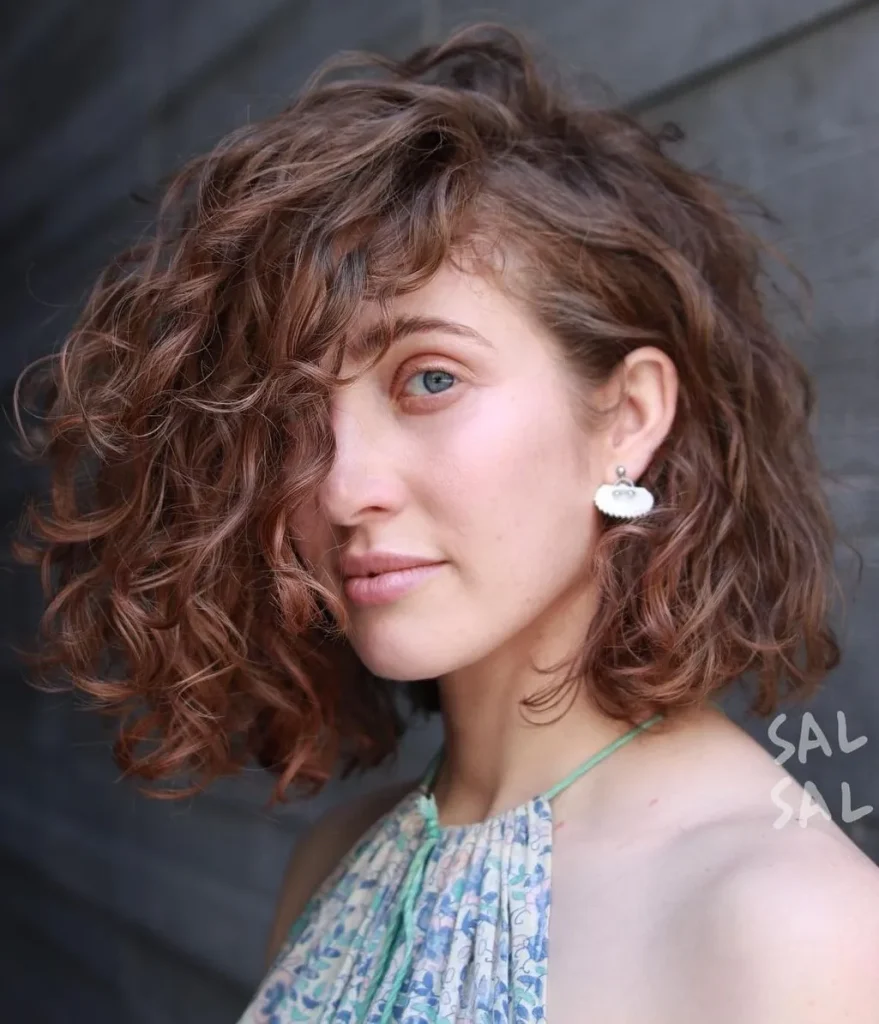 10 Top Hairstyles for Curly Short Hair to Try Side-Parted Curls